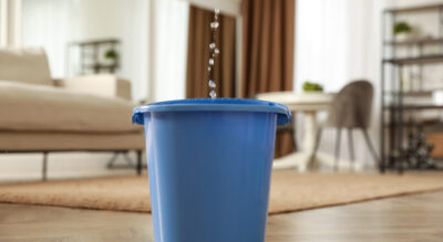 water-leak-400×267-2 ceiling leaking water into a blue bucket