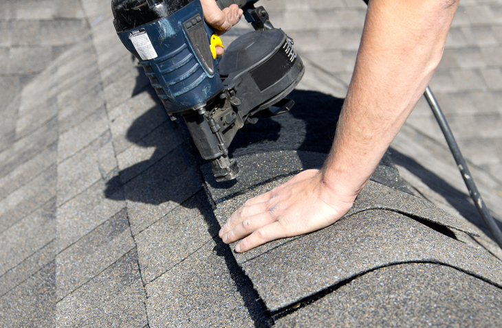 Nailing shingles on roof